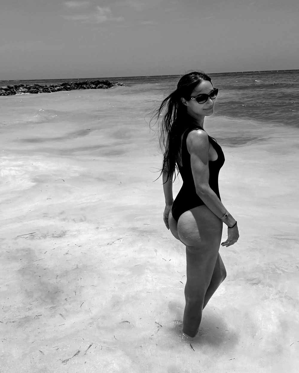 Joelle Bitar, Montreal real estate broker specializing in luxury real estate, on a beach in Jamaica